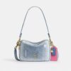 Listonoszka Carey z postarzanego dżinsu z zawieszkami