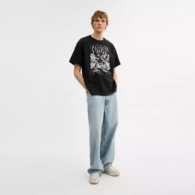 Luźny T-shirt „Dinosaur City” z bawełny organicznej