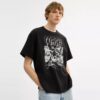 Luźny T-shirt „Dinosaur City” z bawełny organicznej
