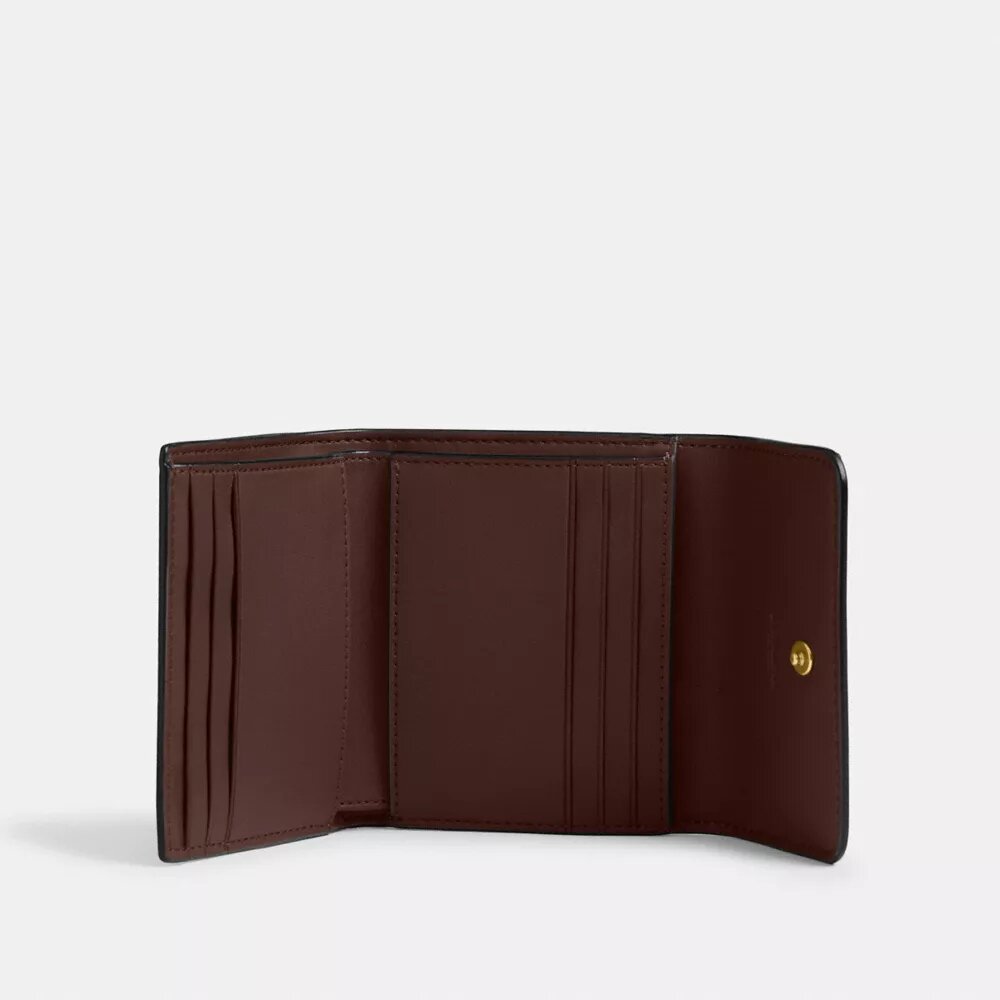 Mały portfel Mila z klapką, wykonany z Signature Canvas