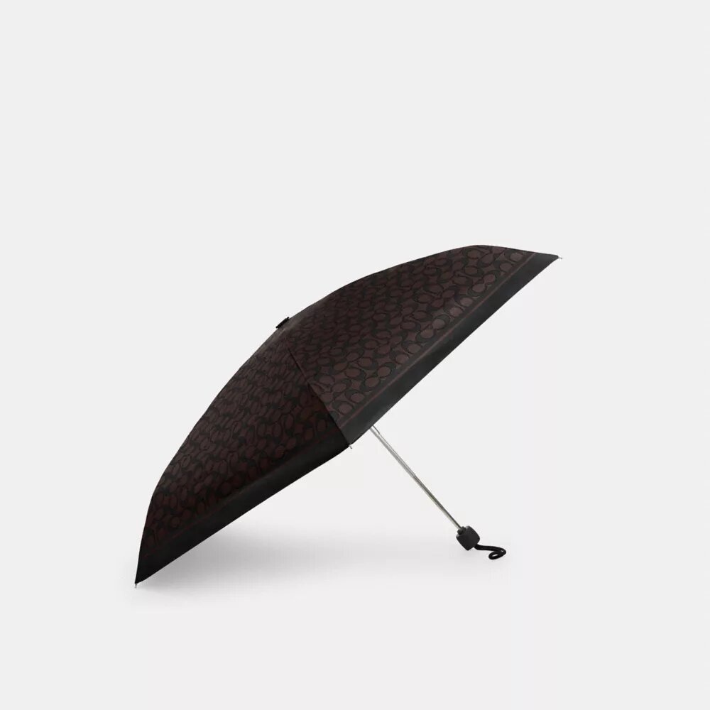 Mini parasolka z ochroną przed promieniowaniem UV w charakterystycznym nadruku