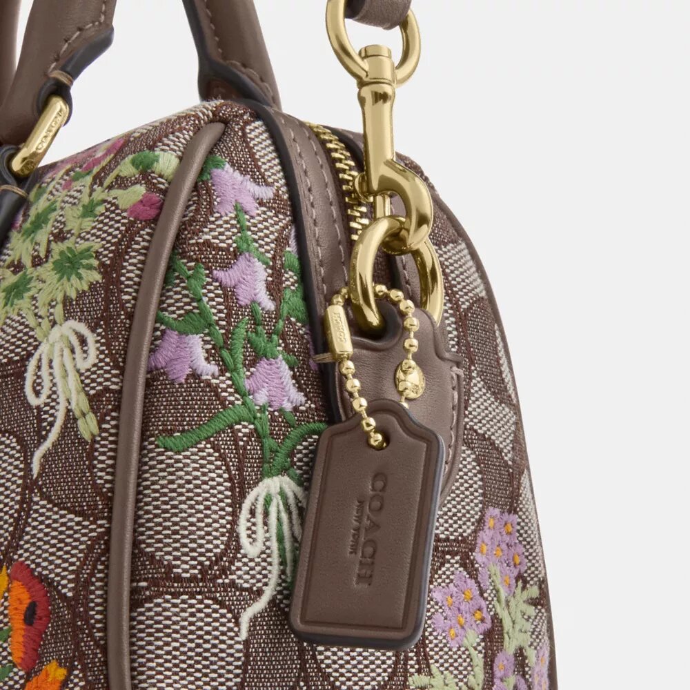 Mini torebka crossbody Rowan z charakterystycznego żakardu z kwiatowym haftem