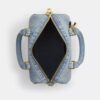 Mini torebka crossbody Rowan z postarzanego dżinsu z zawieszkami