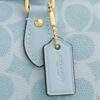 Mini torebka crossbody Rowan z Signature Canvas