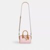 Mini torebka crossbody Rowan z Signature Canvas z zawieszkami