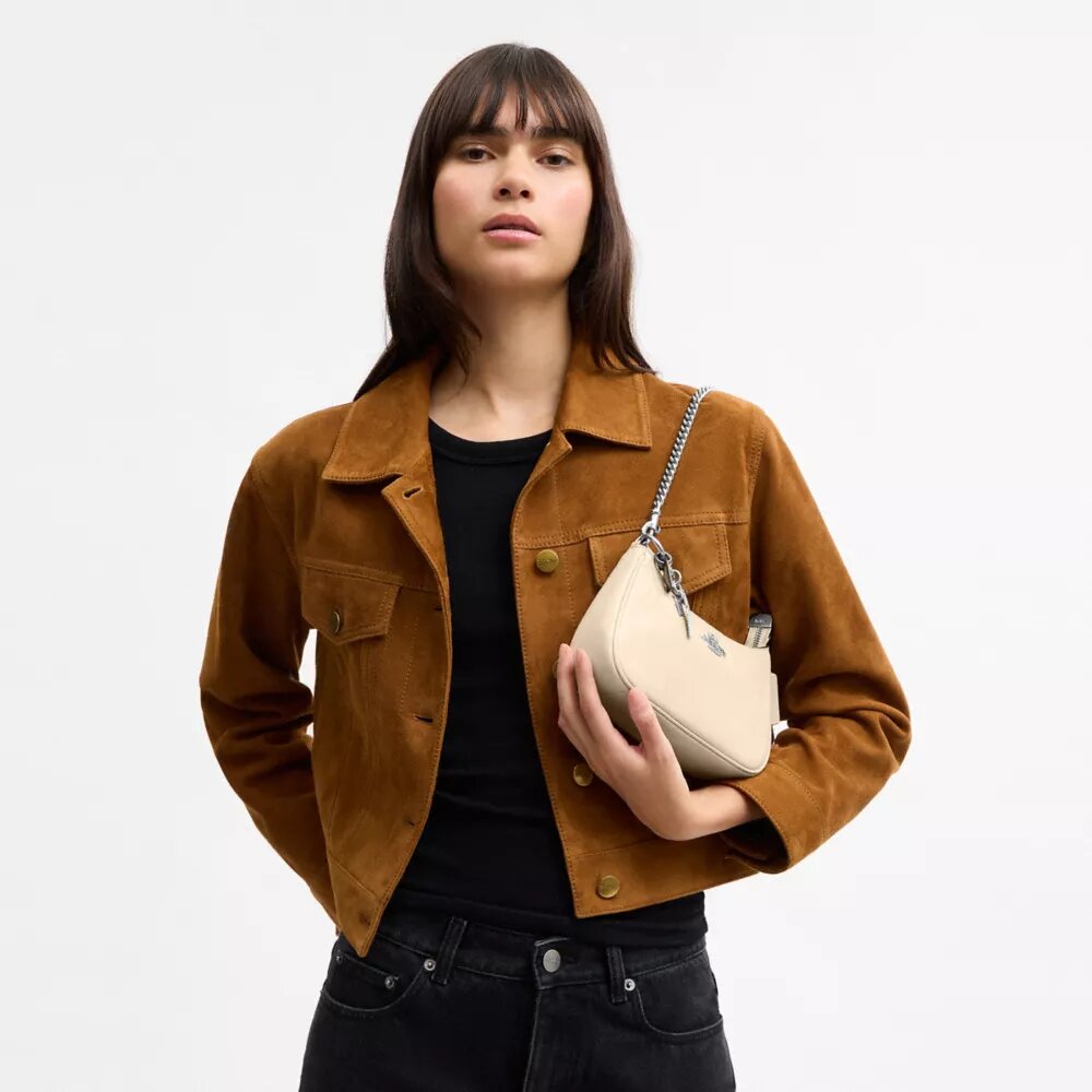 Mini torebka crossbody Teri z zawieszkami