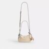 Mini torebka crossbody Teri z zawieszkami