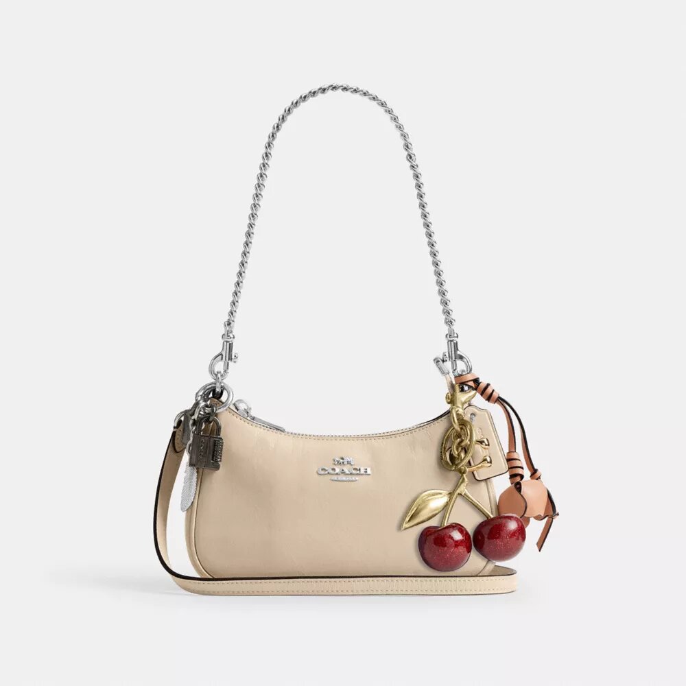 Mini torebka crossbody Teri z zawieszkami