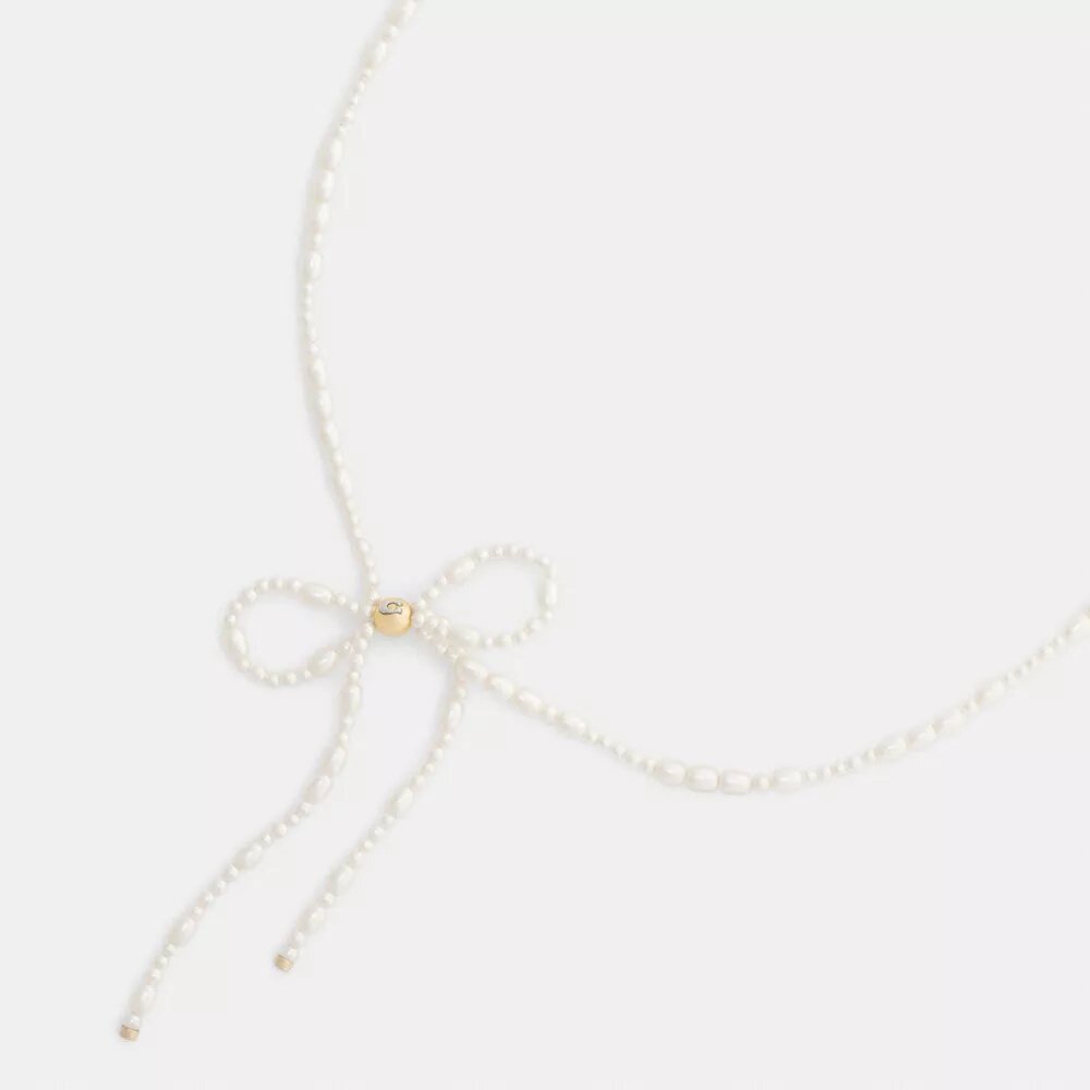 Naszyjnik typu choker z perłową kokardką