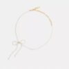 Naszyjnik typu choker z perłową kokardką