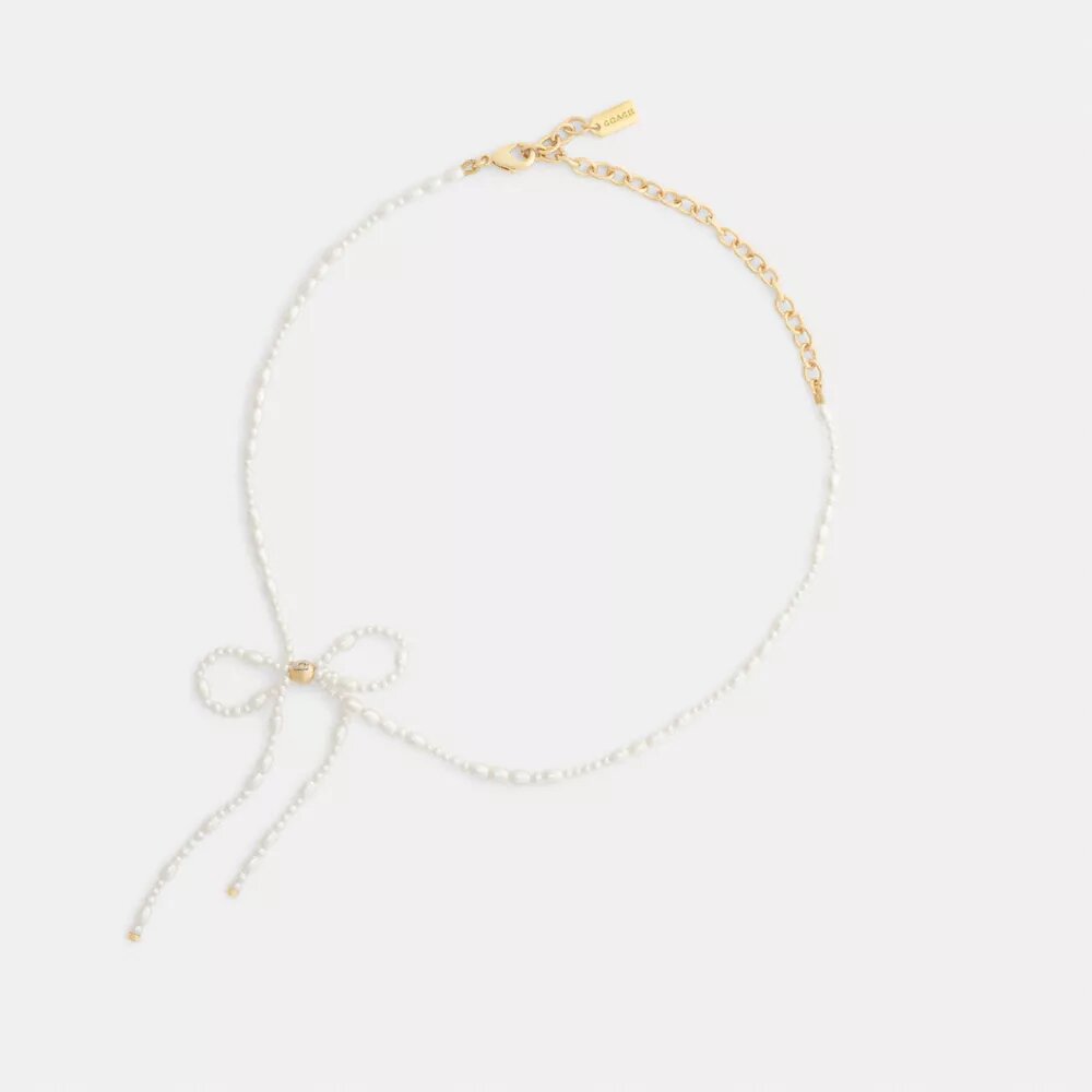 Naszyjnik typu choker z perłową kokardką