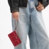 Saszetka na nadgarstek z zamkiem w rogu z charakterystycznego denimu