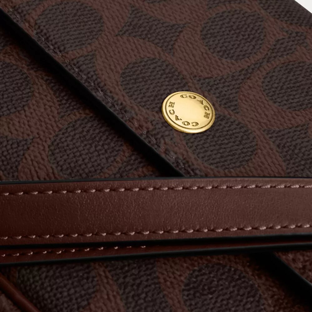Torba Brooke z klapką i łańcuszkiem z Signature Canvas