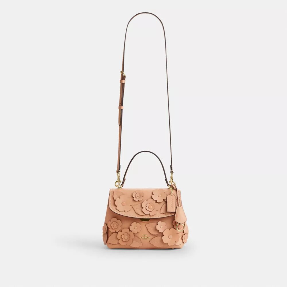 Torba Emory z uchwytem na górze i kwiatową aplikacją