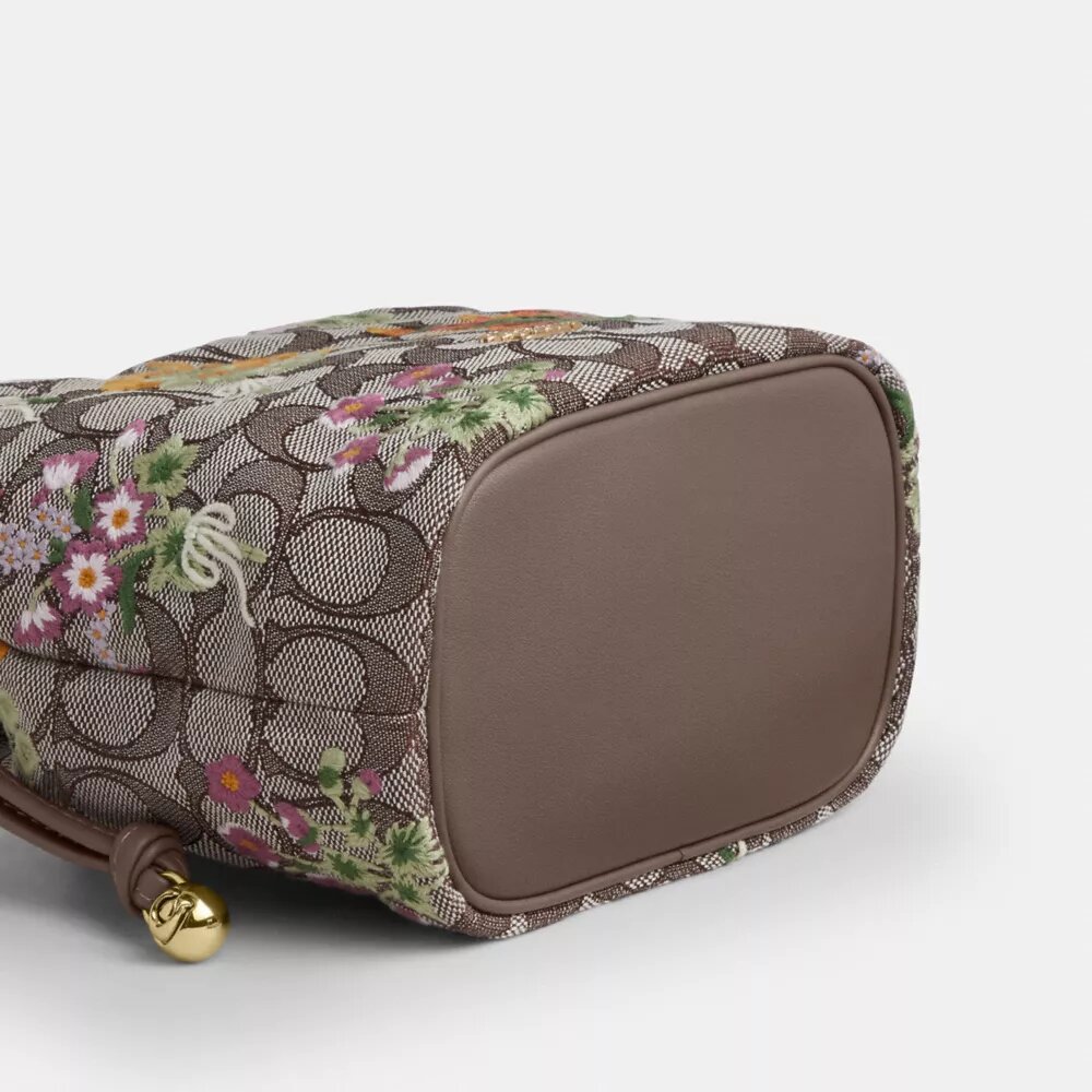 Torba Faye Mini ze sznurkiem, wykonana z charakterystycznego żakardu z haftem kwiatowym