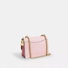 Torba na ramię Klare z Signature Canvas z zawieszkami