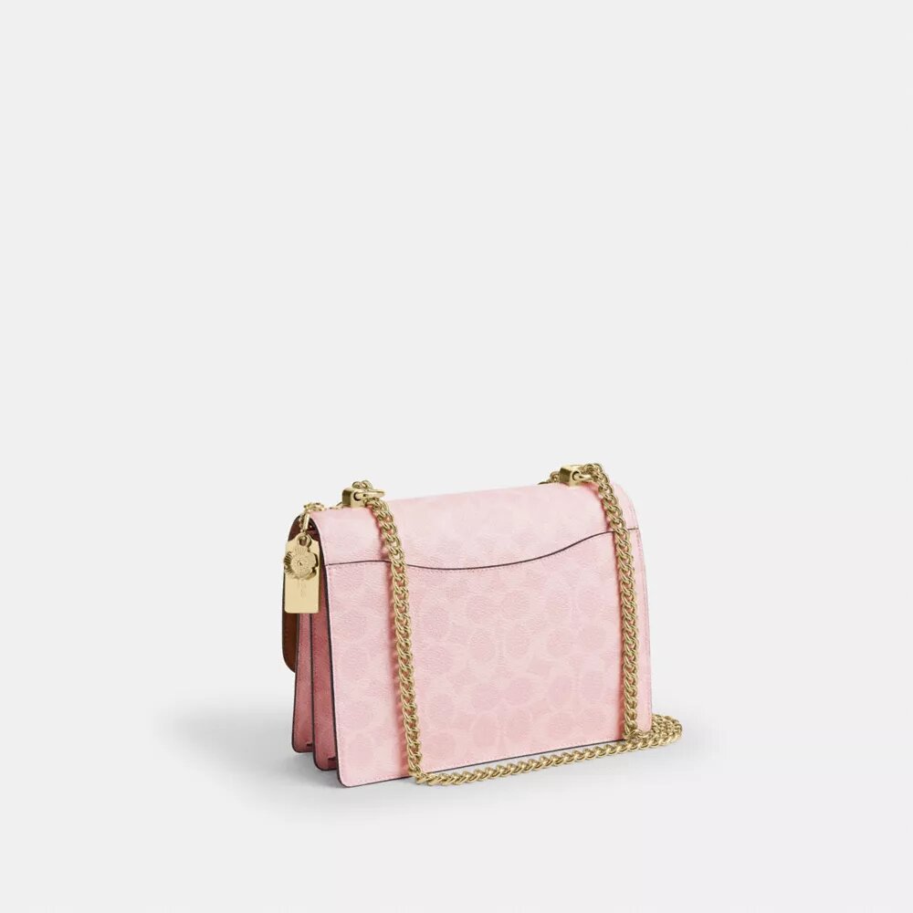 Torba na ramię Klare z Signature Canvas z zawieszkami