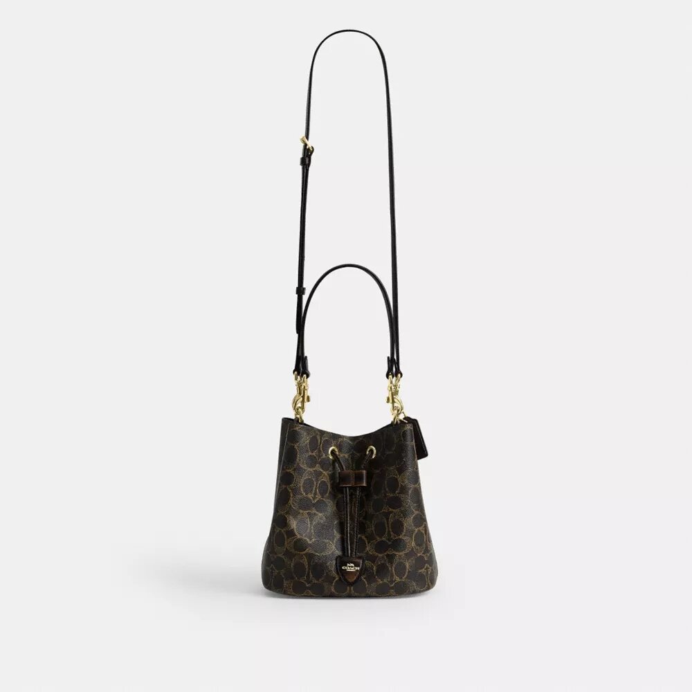 Torba typu bucket Rowan z Signature Canvas z zawieszkami