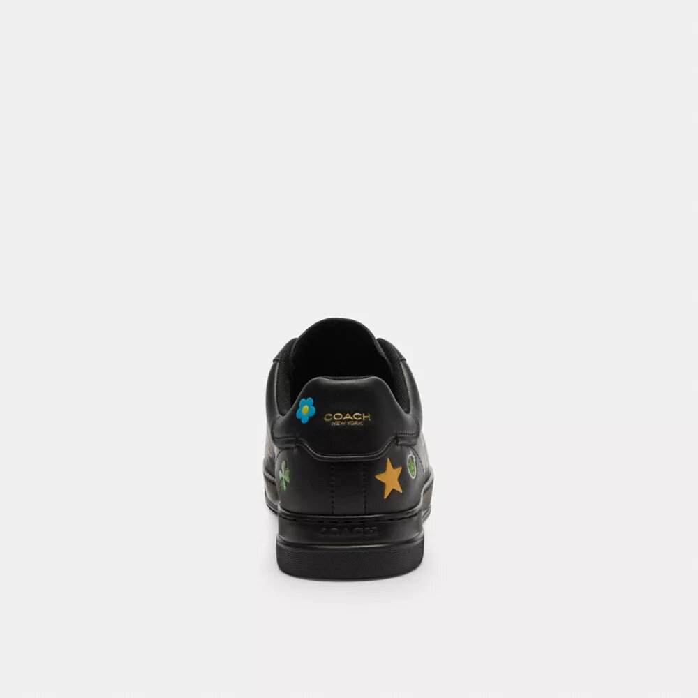 Wysokie sneakersy Disney X Coach z serii High Line z nadrukiem naklejek