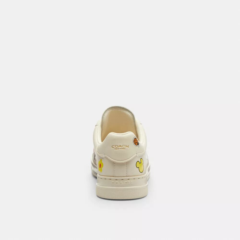 Wysokie sneakersy Disney X Coach z serii High Line z nadrukiem naklejek